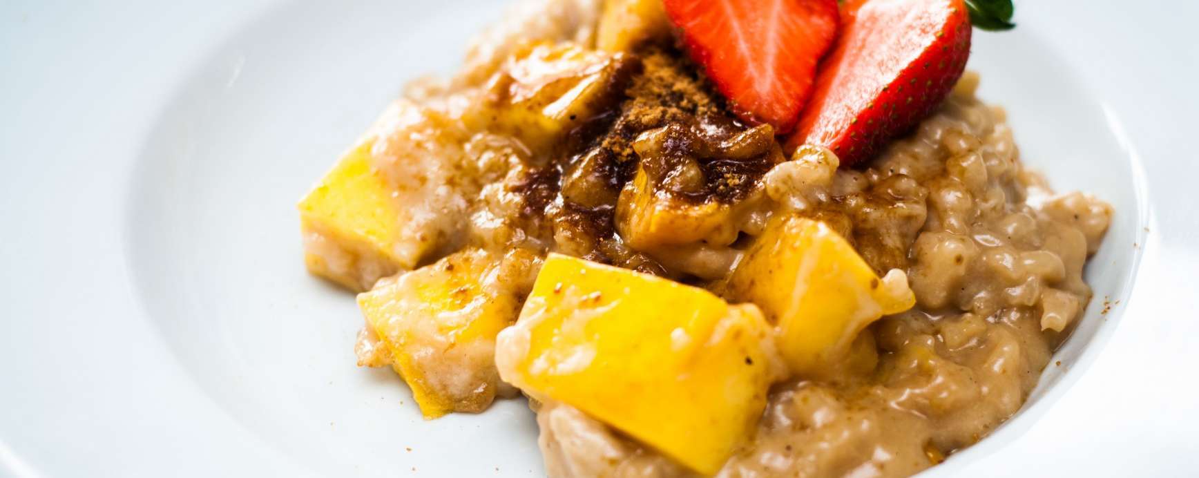 Vegan rice pudding with mango & coconut blossom sugar, healthy dessert